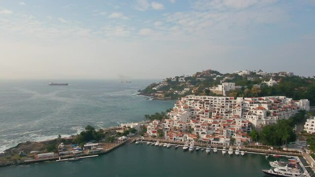 Aerial view of Peninsula de Santiago in city Manzanillo, Mexico. Beautiful bitch and luxury hotels and boat and yacht berth