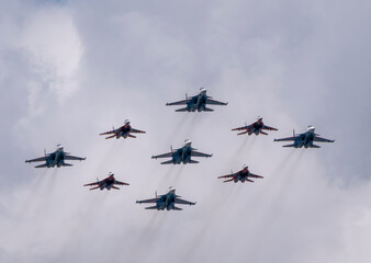 MOSCOW, RUSSIA - MAY 7, 2021: Avia parade in Moscow. group jet fighter aircraft MiG-35 and Su-30 in the sky on parade of Victory in World War II in Moscow, Russia