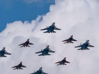 MOSCOW, RUSSIA - MAY 7, 2021: Avia parade in Moscow. group jet fighter aircraft MiG-35 and Su-30 in...