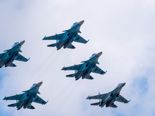 Fototapeta na wymiar MOSCOW, RUSSIA - MAY 7, 2021: Avia parade in Moscow. su-35 and su-34 and su-30 in the sky on parade of Victory in World War II in Moscow, Russia