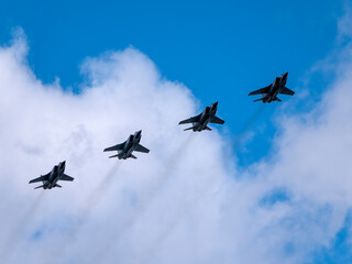 MOSCOW, RUSSIA - MAY 7, 2021: Avia parade in Moscow. group jet fighter aircraft Mikoyan MiG-31 in the sky on parade of Victory in World War II in Moscow, Russia