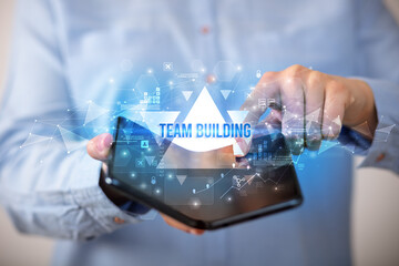 Businessman holding a foldable smartphone, business concept