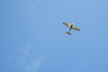 White plane in the blue sky