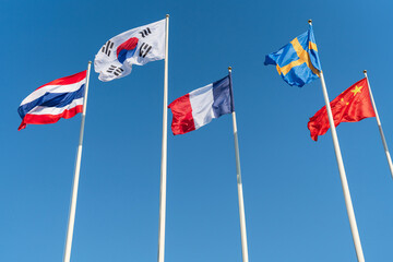 The national flags of five nations, Thailand, South Korea, France, Sweden, China
