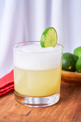 Homemade Pisco Sour Cocktail with Lime and Bitters