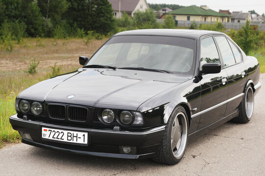 Belarus, Minsk-02.07.2012:Black classic car BMW 7 series E32 (1986 - 1994) on the autumn road.