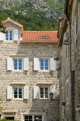 Fototapeta na wymiar Perast, Montenegro - June 6, 2022: Perast, tourist resort town in the bay of Kotor. Montenegro