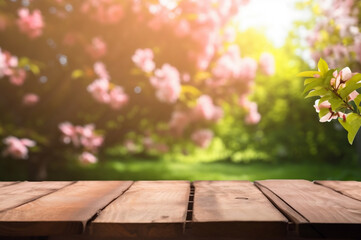 Wooden tabletop, blooming spring garden in the background