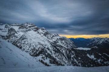 Obraz premium Sunrise in a winter day with fresh snow. Italy, Trentino Alto Adige, Pinzolo and Madonna di Campiglio. January 2023