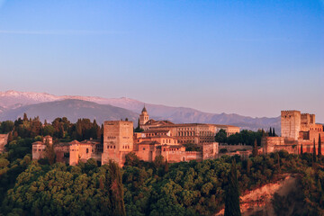 Fototapeta na wymiar Sunset over Alhambra Palace and the Sierra Nevada mountains in Granada, Andalucia, Spain