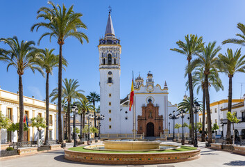 Parish Church of San Juan Bautista in Spain Square in the Municipality of La Palma del Condado, Huelva province, Andalusia, Spain - obrazy, fototapety, plakaty