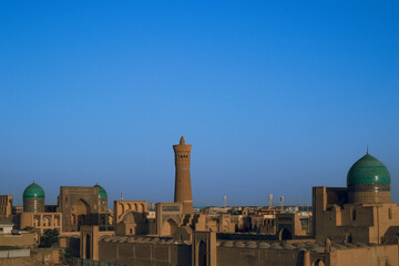 Sunset and Persian architecture in the ancient silk road city of Bukhara, Uzbekistan     