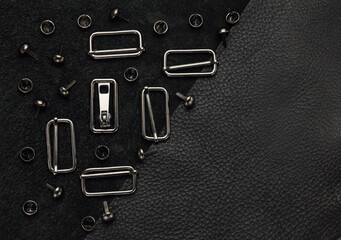 black leather background with fittings