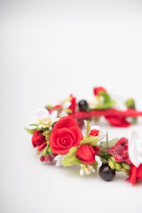 wreath with colored flowers isolated on white