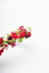 wreath with colored flowers isolated on white