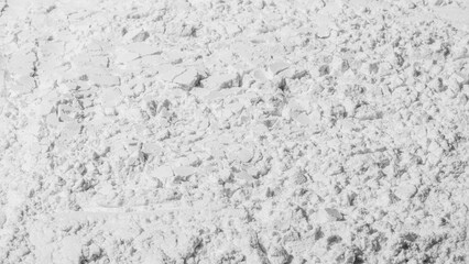 Texture of cracked white sand. powder, flour, cracks. Textured, cracked. White. Banner, advertising. Empty space. For an inscription.