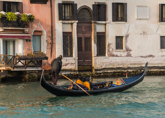 Fototapeta na wymiar gondolier on grand canal in Venice, Italy
