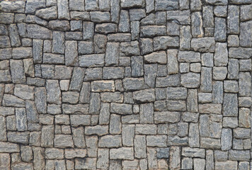 Fototapeta premium texture composed of ornamental gray stones in different tones and variable sizes, with irregular relief harmoniously arranged