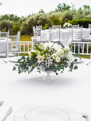 Luxury elegant wedding reception table arrangement and floral centerpiece - wedding banquet and event outdoor