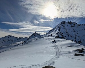 Ski tour through the Winterlücke towards flüela wisshorn. Ski mountaineering in the beautiful Davos mountains. view of the Jörigletscher.