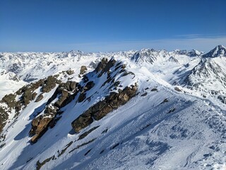 View from the summit of the Flüela Wisshorn above Davos and the Flüela Pass. Ski mountaineering in the Swiss mountains. Wonderful mountain panorama. Davos Klosters Mountains. High quality photo
