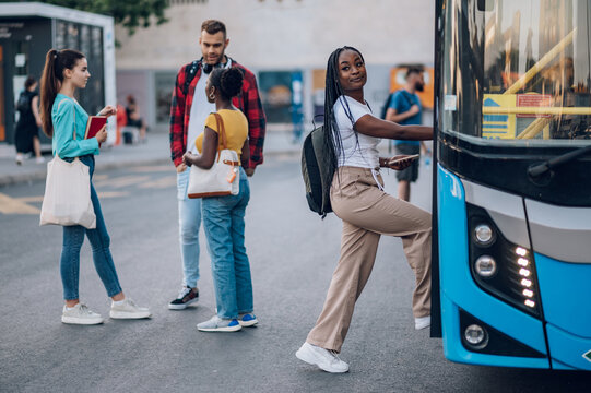 African american woman entering the bus