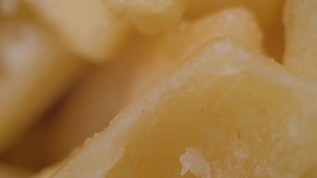 Close up: Chak Chak - fried crunchy honey cake on rotating surface - macro, top view. Traditional Tatar and Bashkir cuisine, oriental dessert, gastronomy, food and Tatarstan national sweet concept