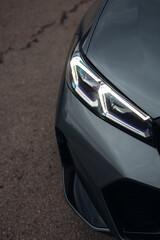 Laser headlight of modern luxury car close up	