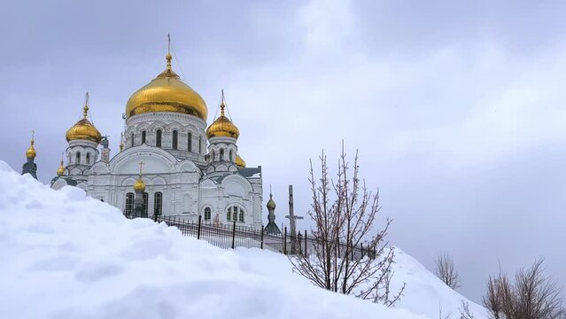 Belogorsky St. Nicholas Orthodox Missionary Monastery. Russia, Perm Krai, Belaya Gora. The temple on the hill in winter. Monastery on the background of snow. 4K