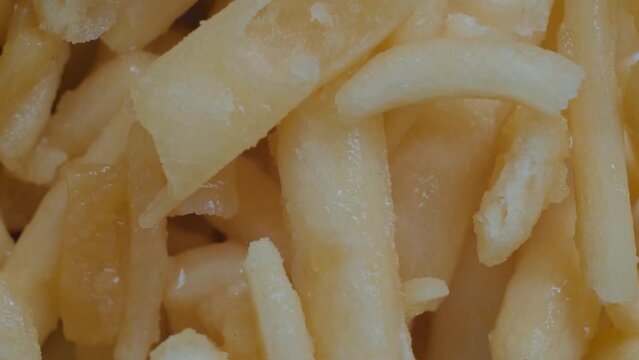 Top view: Chak Chak - fried crunchy honey cake on rotating surface - macro, close up. Traditional Tatar and Bashkir cuisine, oriental dessert, gastronomy, pastry and Tatarstan national sweet concept