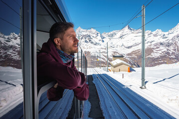 The train of Gonergratbahn running to the Gornergrat station and Stellarium Observatory - famous...