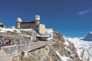 Observatory and hotel on Mount Gornergrat. Landscape of the hotel building and the Matterhorn mountains. Zermatt, Switzerland. - obrazy, fototapety, plakaty