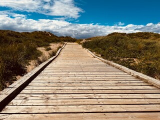 Wooden walkway in sand dunes