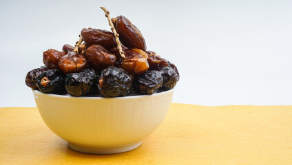 Dates or dattes palm fruit in wooden bowl is snack healthy, Set of various dates in bowl,
