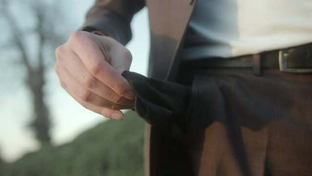Businessman in a Suit Shows Empty Pocket and Demonstrates Being Broke