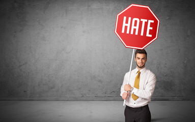 Young business person holding road sign