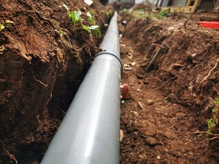 Plastic sawage pipes in the ground for rainwater drainage