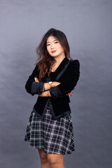 Asian Chinese women in formal office wear wear jackets and skirts. arrogant girl expression posing...