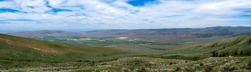 Obraz premium A panoramic view of farm fields in the valley from the Sawtooth National Forest near Albion, Idaho, USA