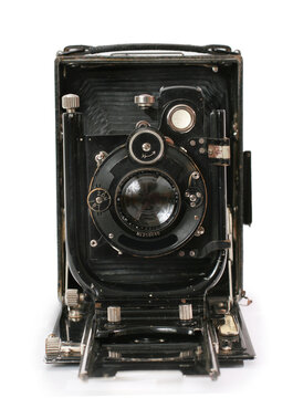 Old antique vintage black camera the 19th century isolated on white background with cliping path. Russia.