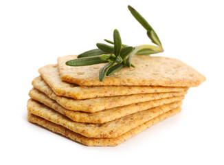 Tasty crackers and rosemary isolated on white background