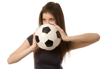 Beautiful athletic girl with a soccer ball on a white background