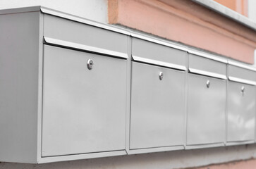 View of mailboxes on building wall, closeup
