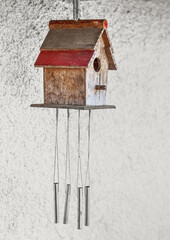 View of wooden bird house hanging in village