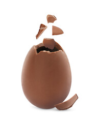 Exploded milk chocolate egg on white background