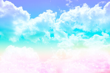 Magic sky with fluffy clouds toned in rainbow colors