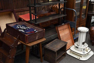 Fototapeta na wymiar The random old antique traditional wooden furniture under the natural sun light in Sapporo Japan