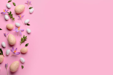 Composition with Easter eggs, beautiful crocus flowers and plant leaves on pink background