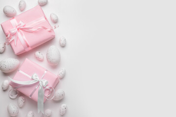 Easter eggs and gift boxes on white background