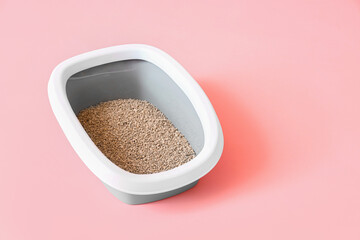 Litter box for cat on pink background
